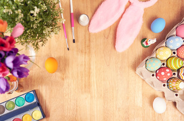 Happy easter, Easter painted eggs on wooden rustic table for your decoration in holiday. Top view with copy space.