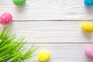 Easter eggs on a white wooden surface