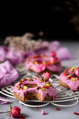 Vegan raw raspberry glaze donuts.selective focus.