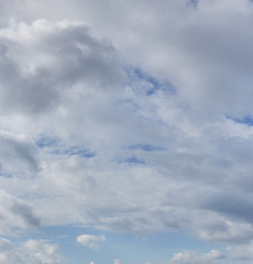White cumulus clouds on a blue sky. Beautiful natural abstract background. Concept of forecast and meteorology