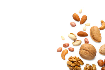 Different delicious nuts on white background, flat lay. Space for text