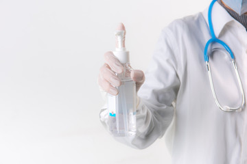 Fototapeta premium Doctor hands using washing hand with Alcohol Sanitizer isolate on a white background. Promoting people use face mask to protect themselves from virus infection in Corona virus crisis 2020