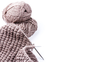 knitting needles and woolen threads on a wooden background. natural wool knitting background