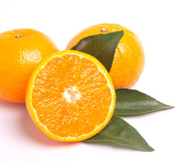 Fresh orange and leaves isolated on white background.