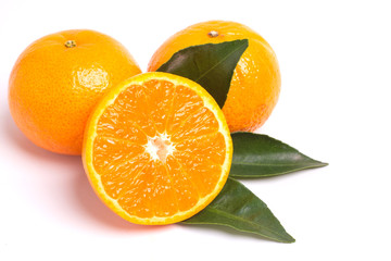 Fresh orange and leaves isolated on white background.