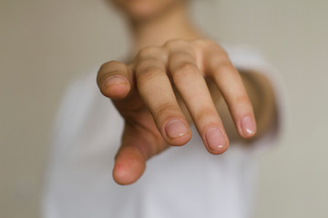 young woman's hand reaching out
