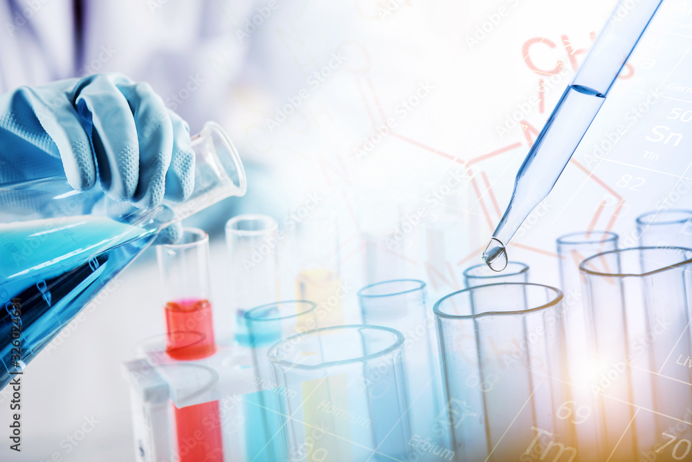 Poster hand of scientist holding flask and pouring sample to test tube with dropping yellow liquid to test 