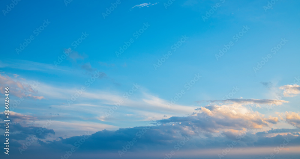 Wall mural beautiful bright sunset sky with clouds. nature sky background.