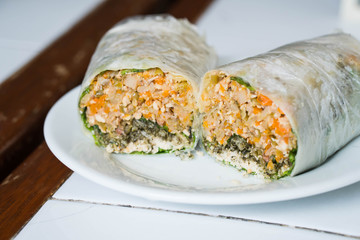 fresh lumpia or mixed vegetables with fresh garlic, sugar with toasted peanut wrapped with thin unflavored pastry crepe and served with thickened sweetened soy sauce 