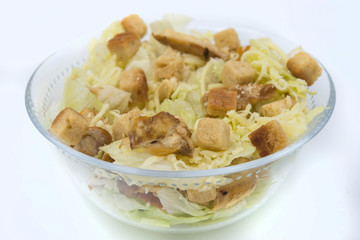 Caesar salad with toast, lettuce and grilled chicken breast and cheese