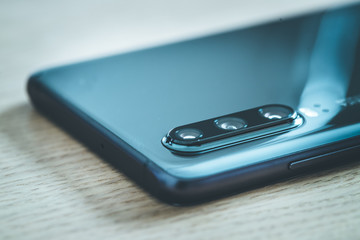 Mobile phone with triple lens. Camera innovation.