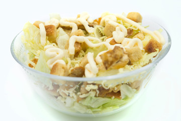 Caesar salad with toast, lettuce and grilled chicken breast , cheese and typical sauce