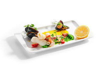 Blanched seafood, cut tomatoes and lemon