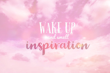 Naklejka na ściany i meble Wake up and smell inspiration word on pink pastel cloudy sky background