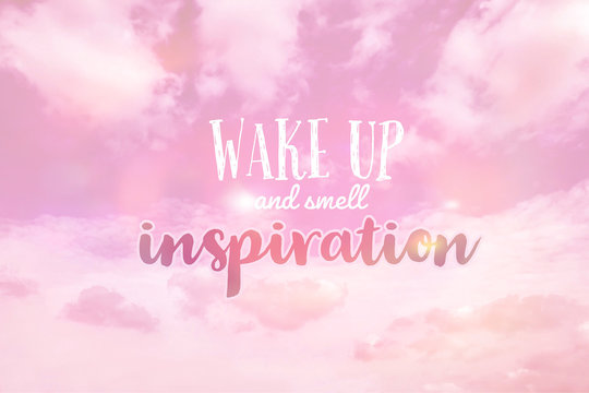 Wake up and smell inspiration word on pink pastel cloudy sky background