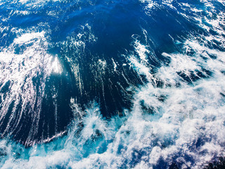 Big dark blue waves for surfing in deep ocean, aerial top view