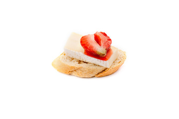 Canape with cheese and sweet strawberry.
