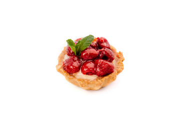 Amazing dessert in tartlet with raspberry and white chocolate.