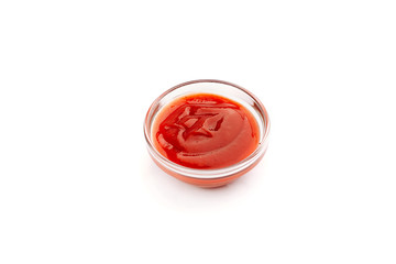 Ketchup sauce in a bowl isolated on white backround.