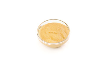 Mustard sauce in a bowl isolated on white backround.