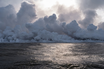 steam billows from lava entering the sea