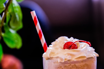 Cherry milkshake on a dark background