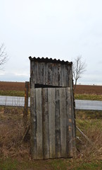 old wooden latrine or toilet in the field