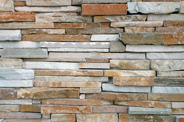 red tan brown slim cut slate rock wall close-up