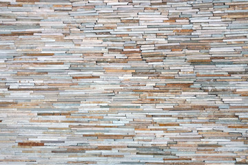 tan brown grey orange thin cut slate rock wall distance view