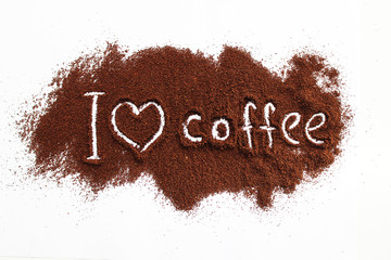 ground coffee sprinkled on a white table with the text 