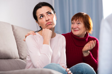 Portrait upset female looking away after conflict, mother talking