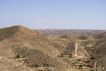 Route to Sahara desert full of rocks