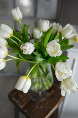vase with a bouquet of flowers white tulips