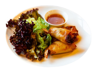 Fried spring rolls with vegetables and shrimps with sauce and salad