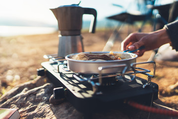moka pot coffee campsite morning lifestyle, person cooking hot drink in nature camping outdoor, cooker prepare breakfast picnic, tourism recreation outside