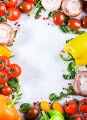 Healthy food background with various green herbs, mushrooms and vegetables. Ingredients for cooking vegan dishes. Vegetarian fresh raw food concept. Top view, copy space