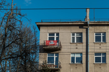 Fototapeta na wymiar Coat of arms of Lithuania flag on the building