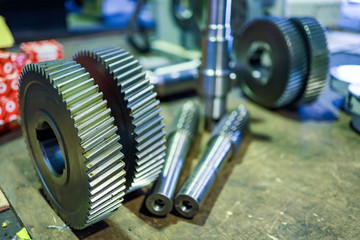 spare part gear wheels and shaft gear on floor wait for assembly