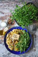 Selective focus. Plate with lentils and micro greens and cbd oil. Cannabis food concept. Vegan food. Diet concept.