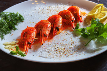 fried shrimp with various spices, lemon and sauce