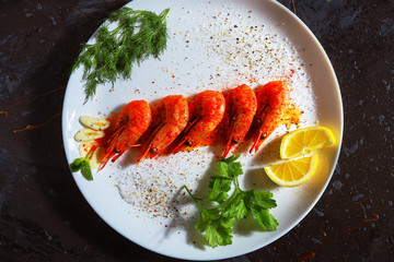 fried shrimp with various spices, lemon and sauce