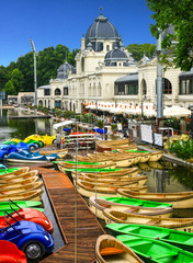 Colored boats on the waterfront waiting for those who want to walk on the lake