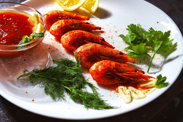fried shrimp with various spices, lemon and sauce