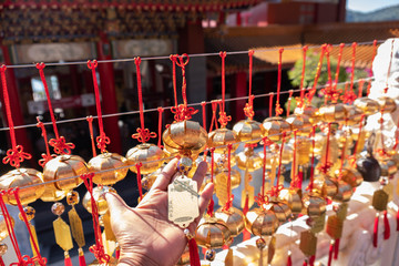 Chinese bell at Wen Wu Temple with prayers which means good luck Good health, prosperity