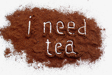 ground coffee sprinkled on a white table, text 