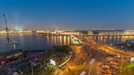 Fototapeta premium Night view of spit of Vasilyevsky Island and Birzhevoy Bridge with rostral column timelapse, Saint Petersburg, Russia.