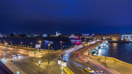 Fototapeta na wymiar Malaya Neva river. Birzhevoy Exchange Bridge and traffic at night timelapse. St.-Petersburg, Russia