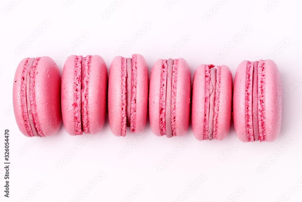 Wall mural French Strawberry Macarons Six Pastel Macarons on White Background Pink Macarons Horizontal