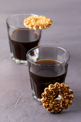 Two Cup of Coffee Americano and Tasty Cookies with Nuts Vertical Gray Background