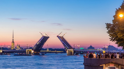 View of the closing Palace Bridge timelapse, which spans - the spire of Peter and Paul Fortress